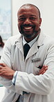 Meeting, face and man in hospital with arms crossed, clinical service and pride in medical career. Happy, team and mature doctor with confidence, general practitioner and about us in health industry.
