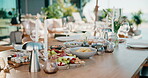 Party, food or charcuterie board outdoor with candles, sushi arrangement or table setup at gathering. Celebration, nutrition or catering with platter, appetizer or snack selection in backyard event.