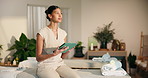 Smile, woman and typing at spa with tablet, massage preparation and schedule for hospitality. Happy, masseuse and digital tech at resort with booking confirmation, appointment and treatment agenda