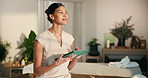 Smile, woman and thinking at spa with tablet, massage preparation and schedule for hospitality. Happy, masseuse and digital tech at resort with booking confirmation, appointment and treatment agenda