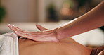 Hands, therapist and client at spa with back massage, deep tissue or luxury service for pain relief. Wellness, person and masseuse with pressure technique for body pamper, healing therapy and tension