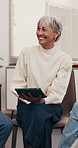 Therapist, woman and tablet in discussion with support group, wellness tips and guidance in clinic. Psychologist, mature person and talk in meeting with tech, counseling and advice for mental health.