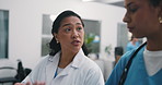 Doctor, walking or team planning with nurse for medical history, feedback and schedule update. Hospital worker, women and conversation for healthcare checklist, diagnosis review or tablet for admin