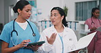 Clinic, walking or team planning with tablet for medical research, feedback or schedule binder. Doctor, women and talk with nurse for collaboration, healthcare document or admin report with tech