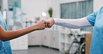 Nurse, team and hands in hospital with fist bump, support and encouragement on double shift. People, clinic partners and gesture at center for solidarity, medical collaboration and healthcare service