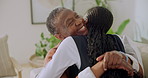 Happy, hug and nurse with senior woman in home for comfort, bonding and connection on sofa. Retirement, smile and caregiver with African patient embrace for affection, medical support and trust