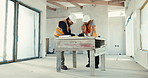 Engineer, team and talk with blueprint for home renovation, plan or opinion for property development. Men, discussion and remodeling house with layout for real estate project, design and engineering.