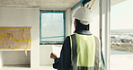 Civil engineer, walking and woman with blueprint in building, safety check and property development. Construction site, inspection and person with paperwork for project management and real estate