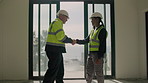 Handshake, construction and welcome with people on site for building inspection, team or review. Remodeling brief, architecture renovation or shaking hands with contractor for property development
