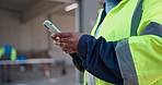 Architect, hands and typing with phone on construction site for building discussion or conversation. Person, contractor or civil engineer chatting with network or app for mobile texting or connection