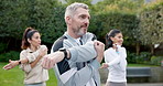 People, fitness and stretching with coach in nature for outdoor exercise or workout preparation. Group, mentor or personal trainer with team or body warm up for health or wellness together in park