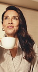 Woman, relax and drink coffee in hotel room with smile, positive mindset or vision for calm holiday. Happy, mature person, peaceful morning in accommodation with tea, reflection or chill on vacation.