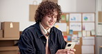 Ecommerce, man and smile in office with phone, research sales data or good review for retail seller. Happy, person and typing in small business with tech, app insights and stats for online order.