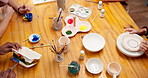 Hands, people and painting in class with pottery, sculpture and custom design of handmade craft. Friends, paint brush or decorating in workshop with ceramic activity, artistic process and diy artwork
