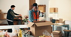 Woman, volunteer and box with food for donation, collection and non profit for charity outreach. Person, packing or groceries in cardboard for delivery, canned goods and aid parcel for poverty relief