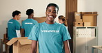 Woman, volunteer and face in NGO with smile, community service or outreach program for relief. Coordinator, representative or happy at event for food drive, social responsibility or donations for aid