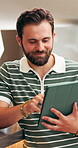Reading, tablet and man in cafe with scroll, website review and stock checklist in digital track. Hospitality, happy and owner with technology, inventory management and menu update on restaurant app.