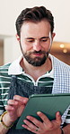 Man, waiter and reading at cafe with tablet, research and inventory management for menu update. Smile, person or review at coffee shop with digital, stock checklist and increase price for hospitality