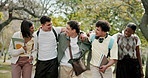 Happy, friends or university student outdoor with walk, group hug or connection in higher education. Diversity, gen z or people with laughing, peer bonding or college support in study opportunity.