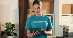 Volunteer, woman and search in charity with tablet, donation website and planning non profit project. Person, outreach and browse with tech, social responsibility or online application for NGO grant.