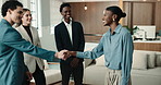 Happy, meeting or business people with handshake for team onboarding process or welcome in office. Group, employees or shaking hands with new workers for career start, introduction or job opportunity