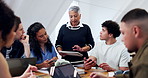 Tablet, lecturer and talking with university students for learning, course or assignment review. Tech, people and speaking with professor in college for knowledge, education curriculum and teaching