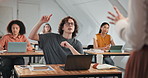 Education, question and college student in classroom with hand up, learning or talking in lecture. Laptop, university and man in lesson with teacher, knowledge development or asking academic query