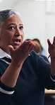 Professor, woman and students in class for lesson, exam preparation or support with learning tips. Talk, mature lecturer or teaching at university for course insight, explain essay topic or education