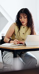 Student, writing and notebook in college with tablet, watch online lecture and preparation for test. Woman, study and taking notes in university with tech, virtual lesson and learn for education.