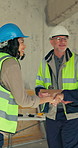 People, tablet and handshake on construction site for meeting, development team and compliance. Women, man or shaking hands at worksite with tech, electrical engineering advice or building feedback
