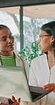 Realtor, women and meeting with laptop for property development, report or proposal in office. Business people, chat and broker with tech for valuation, discussion and planning at real estate agency