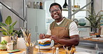 Pottery, black man and painting ceramic in shop for merchandise, creative and small business. Portrait, workshop and handmade craft store for manufacturing, productivity or artist person in startup