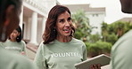 Community service, volunteer and group with tablet, outdoor and explain task assignment on website. Charity, team and happy people with tech, social responsibility and discussion with NGO schedule