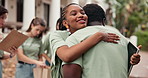Smile, woman and volunteer outdoor with hug, thank you and participation for community service. Happy, people and embrace team with tablet for greeting, partnership and appreciation for charity event