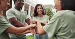 Happy, volunteer and meeting with hands together in city for community service, mission or winning. People, NGO or group with team, high five or applause for donation or charity success in urban town