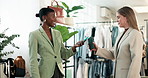 Shopping, purchase and women with machine, phone and pos in store for bargain, sale and payment. Mall, fashion and person for online transaction, checkout and tap in boutique for clothing deal