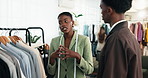 Fashion, choice and stylist with advice in boutique, shopping and consultation for outfit selection. People, discussion and assistance for client, explain and help for clothing decision in store