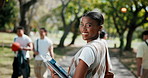 Face, park and happy woman with books for academic learning journey, travel or outdoor commute. Portrait, female person or exchange student with smile for growth, development or foreign scholarship