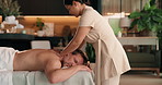 Spa, relax and man on bed for back massage with physical therapy, sleep or resort hospitality. Hotel, female masseuse and mature person for stress relief, muscle reflexology or holistic detox
