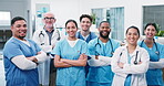 Medical, team or face in hospital with arms crossed, patient care or service ready in primary health. People, doctors or nurses with laugh in ward for healthcare integrity, clinic staff or confidence