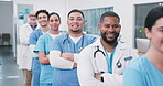 Smile, face and medical team with arms crossed in row for primary health, clinic staff and about us. Nurses, doctors or happy people in hallway for patient care, service pride and healthcare in line