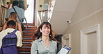Professor, woman and arrival at university with students, greeting or knowledge for higher education. Flare, happy lecturer and people on stairs with books, morning and welcome to college faculty.
