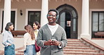 Man, walk and phone in university with headphones, typing text message and listen to music playlist. Happy, person and student outdoor on college campus with audio tech, streaming radio and song.