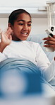Happy, child and video call in hospital bed with phone, conversation and update on disease recovery. Girl, online meeting and talk in clinic with tech, medical treatment and feedback for healing.