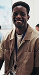 Marketing, face and man in meeting with smile, creative consultant and about us in PR office. Happy, team or branding specialist with laughing, campaign planner or confidence in communications.