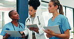 Medical team, women and planning with document in hospital, treatment schedule or care coordination. People, doctor and nurses with healthcare paperwork, clinic report or tablet for patient history