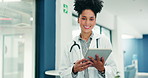 Doctor, face or happy woman with tablet in hospital for medical results or research in hallway. Portrait, female person or smile with technology for healthcare schedule, advice or treatment in clinic