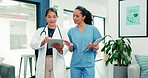 Medical team, doctor and nurse discussion with tablet, review records and case report evaluation. Happy women, healthcare and collaboration with tech, laughing and walking with documents in hospital