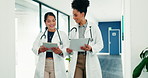 Medical team, women and planning with tablet in hospital, treatment schedule or care coordination. Happy people, doctors and healthcare paperwork, report or walking in clinic with tech for results