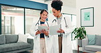 Doctor, women and walking with tablet in hospital for medical study, results or research together. Female people, healthcare workers or team working with technology or portfolio for health exam